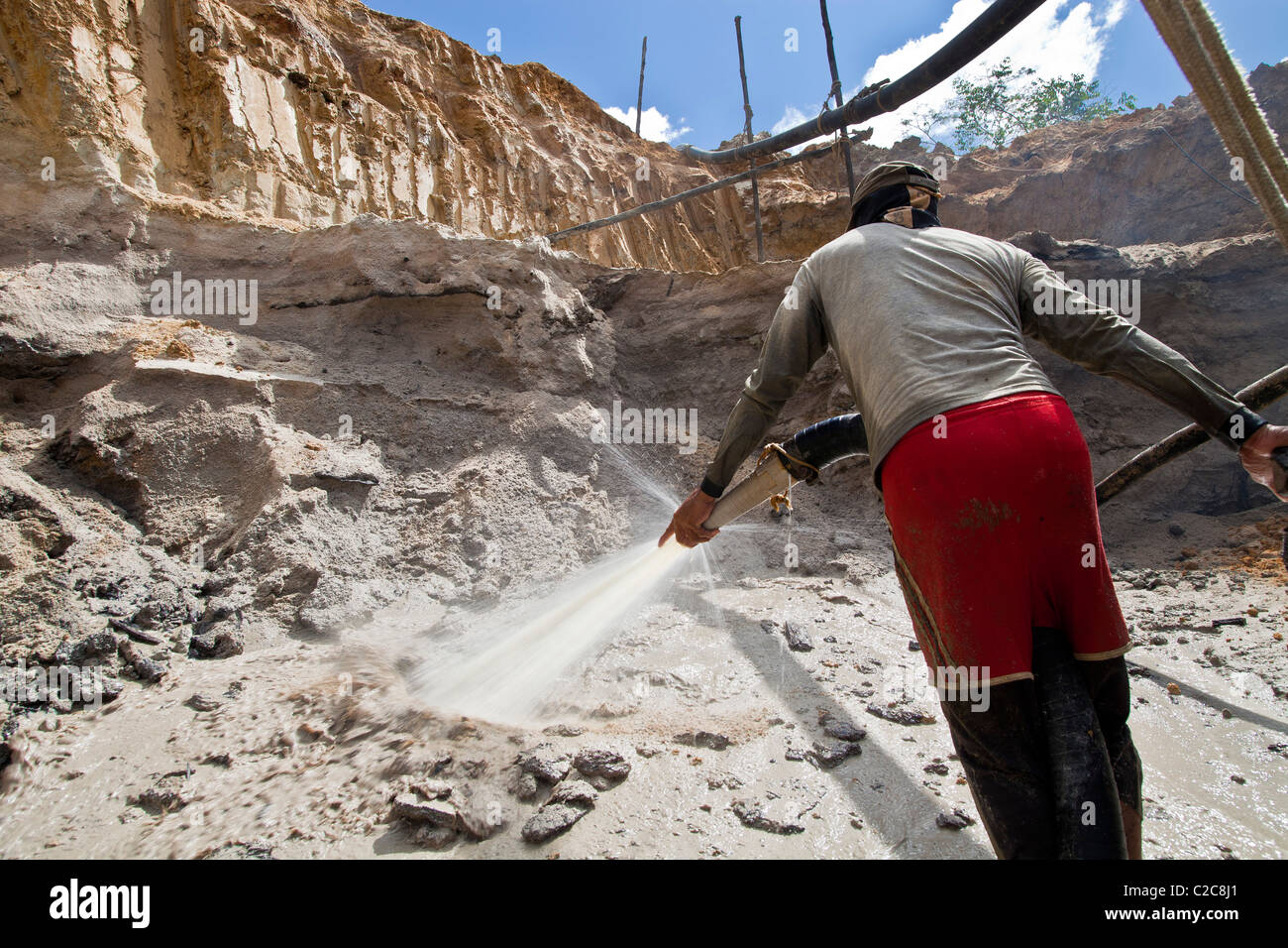 Gold mining in Amazon rain forest Brazil high-pressure jets of water to dislodge rock material chupadeira system Stock Photo