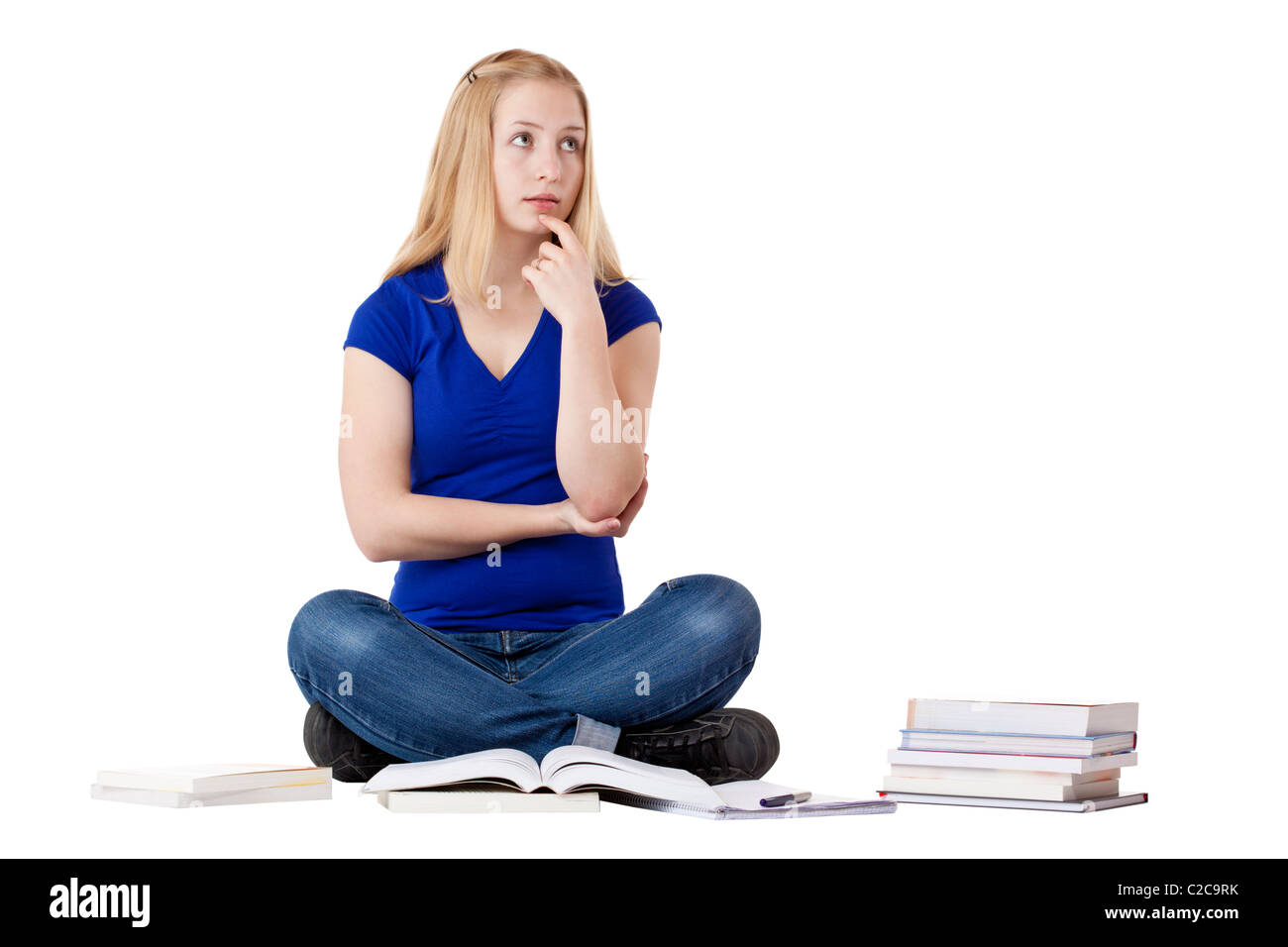 Student Contemplation Young, beautiful, contemplative female student with books looking up ...