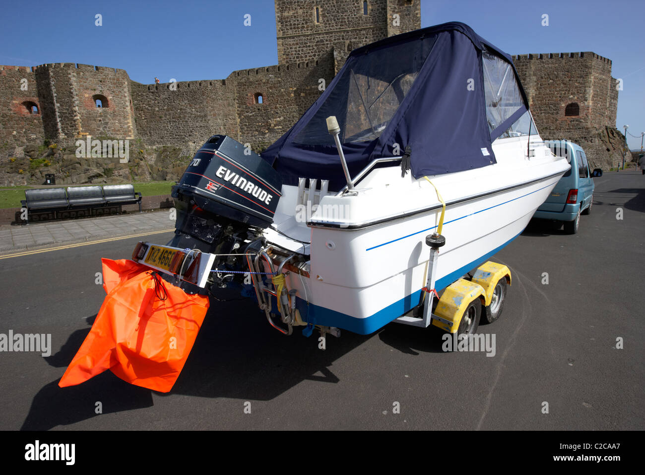 outboard engines trailer light board and high visibility prop covers on a boat being towed in