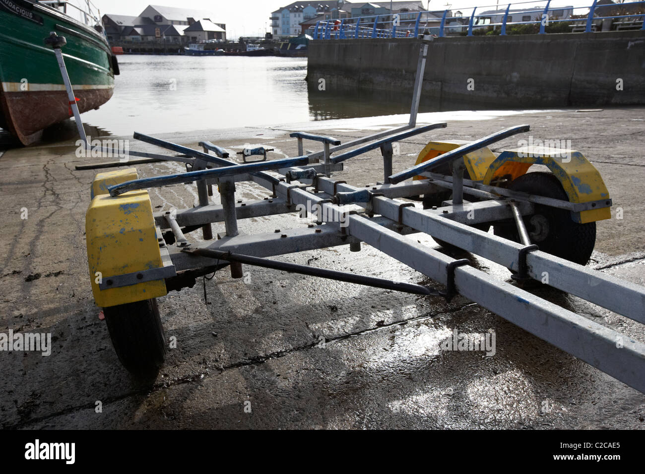empty boat trailer on a slipway after boat launch Stock Photo