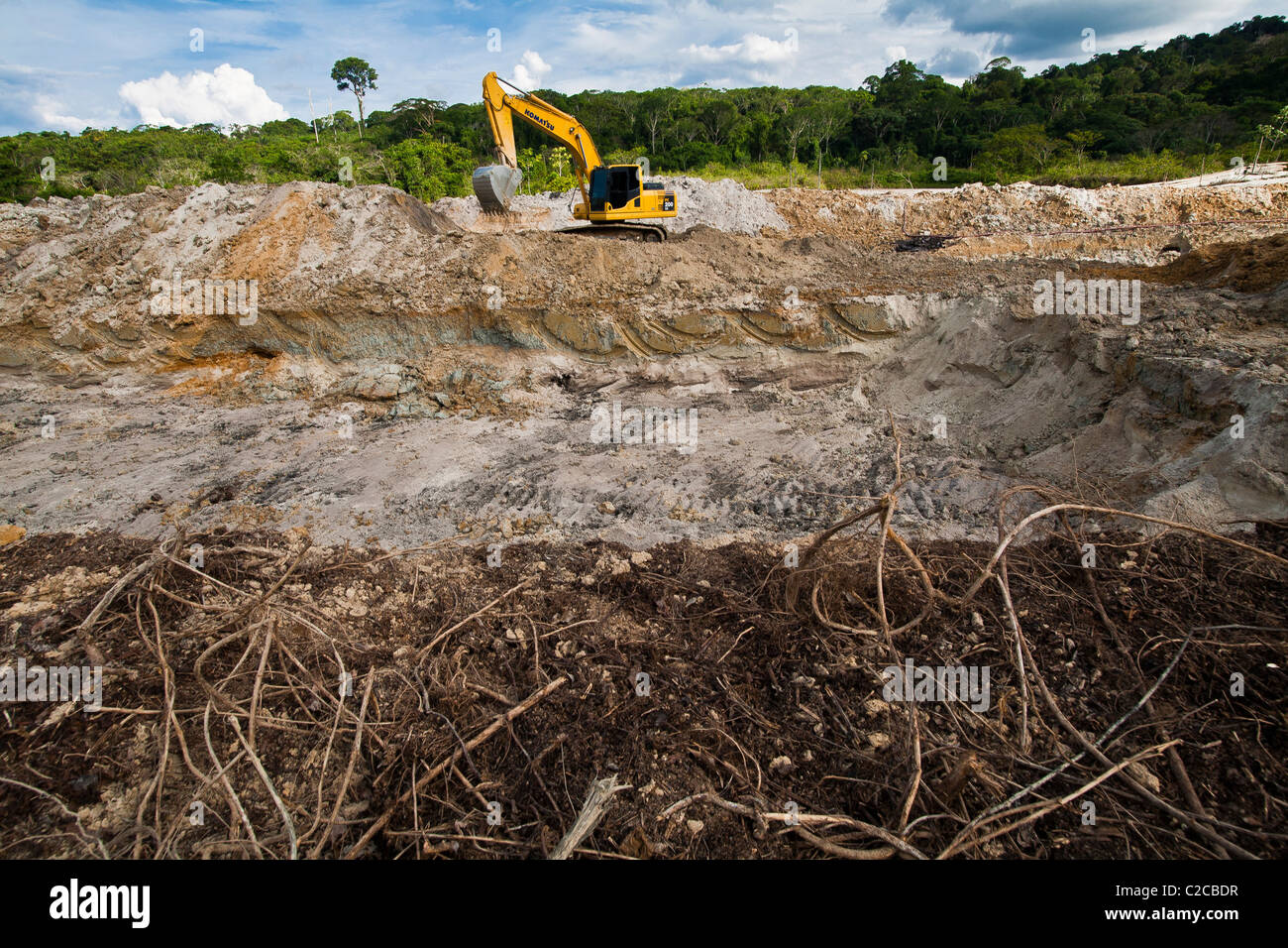 Amazon gold mining Large and deep holes are made in forest land where