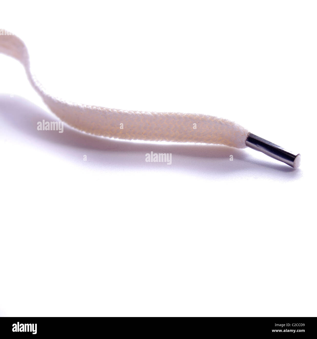 The metal anglet at the end of a shoelace Stock Photo Alamy