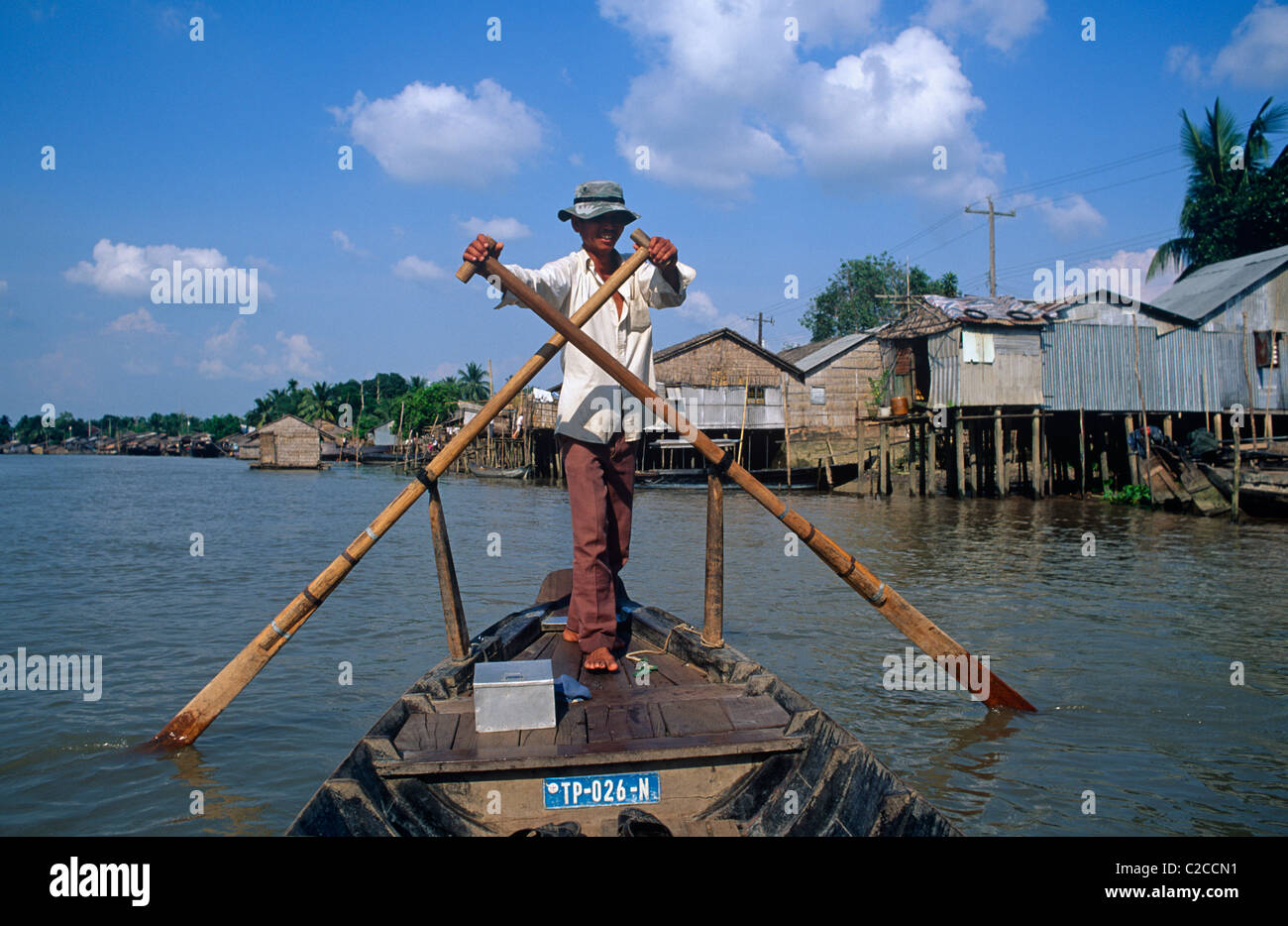 Man rowing small boat on the Hậu River, Can Tho, Mekong Delta, Vietnam ...