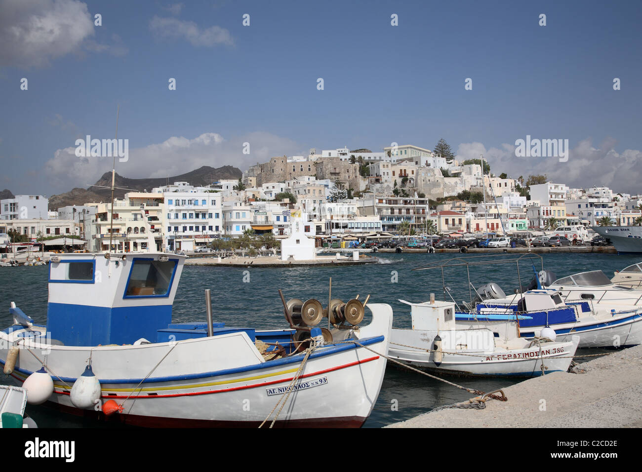 Fishing boats with Naxos Harbour behind, Waterfront, Naxos, Cyclades Islands, Greece Stock Photo