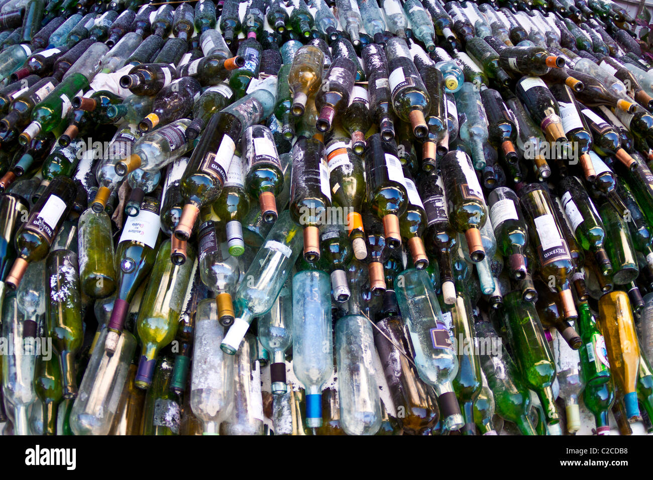 A huge pile of glass bottles waiting recycling. Stock Photo