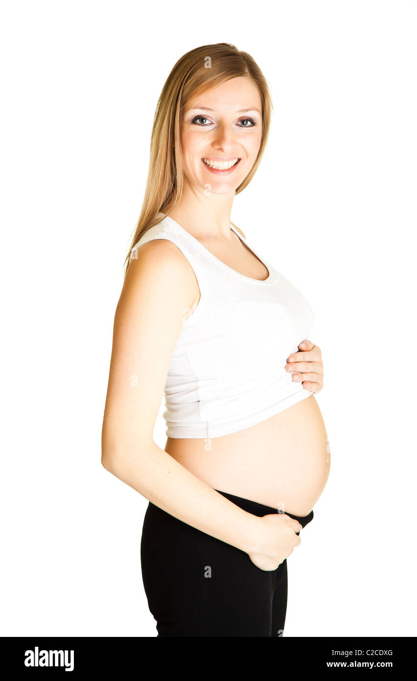 Caucasian blond 6th month pregnant young adult woman excercises fitness