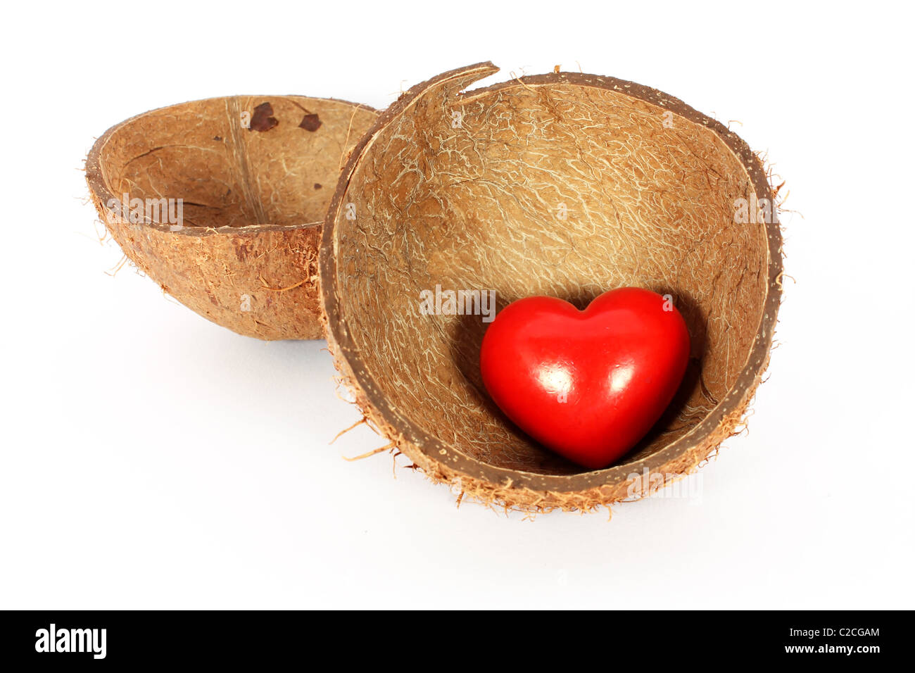 Heart in coconut shell isolated on white Stock Photo