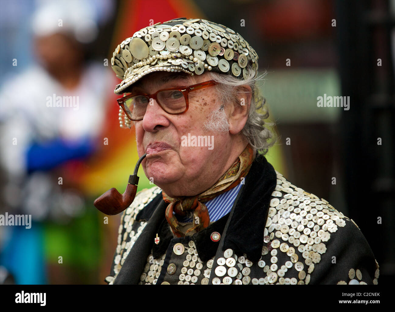 Pearly King smoking a pipe during the New Years Day Parade Stock Photo