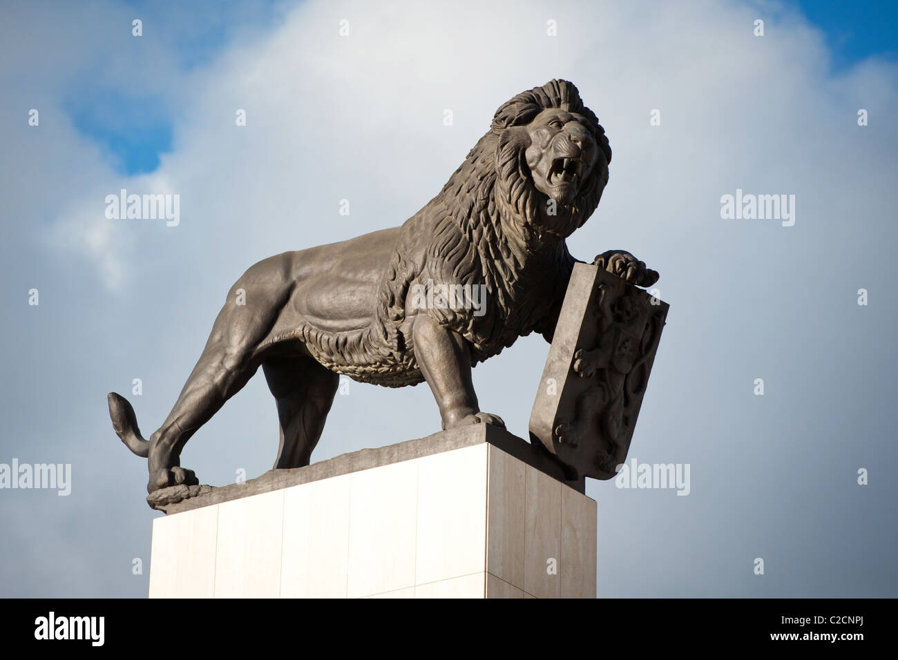 statue of huge bronze lion holding Czechoslovakia symbol, Bratislava, Slovakia Stock Photo