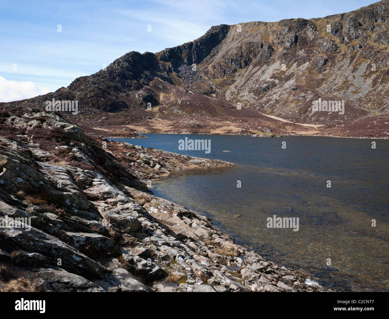 The summit of Moel Siabod and its east ridge, Daear Ddu, seen across the lake of Llyn y Foel Stock Photo