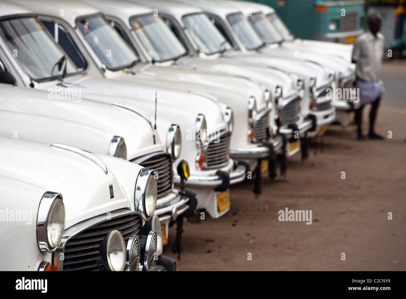 White Ambassador taxi cars line up waiting for business,  Varkala, Kerala, South India Stock Photo
