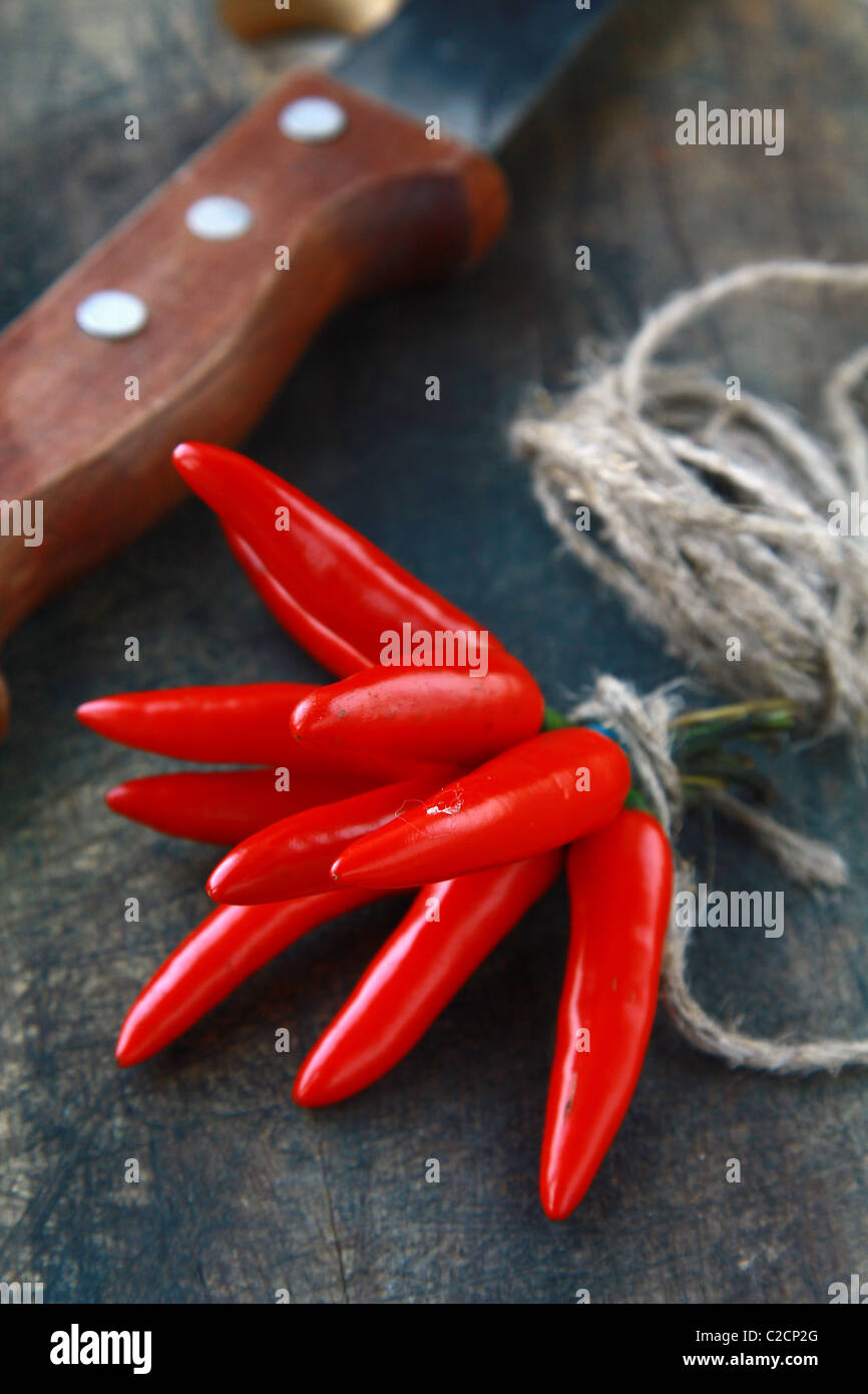 Red hot chili peppers over wooden background Stock Photo - Alamy