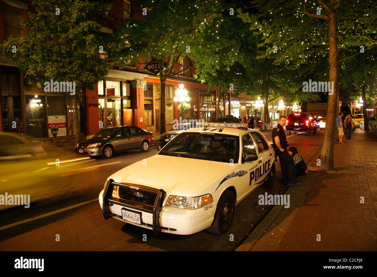 Vancouver police in Gastown at night, Downtown Vancouver, British Columbia, Canada Stock Photo