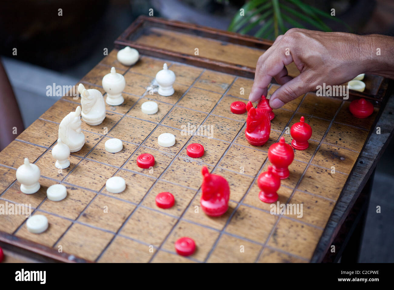 Local Thai people play old traditional Thai chess in public area - slow  life style local people with chess board game concept Stock Photo