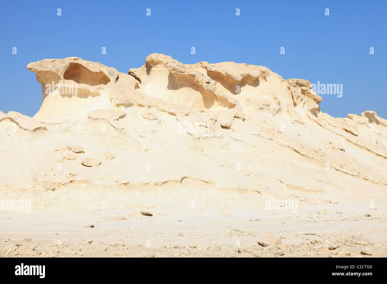 Eroding jebels (mesas) in south-west Qatar, Arabia The calcareous marl acts as a weak cap-rock. Stock Photo