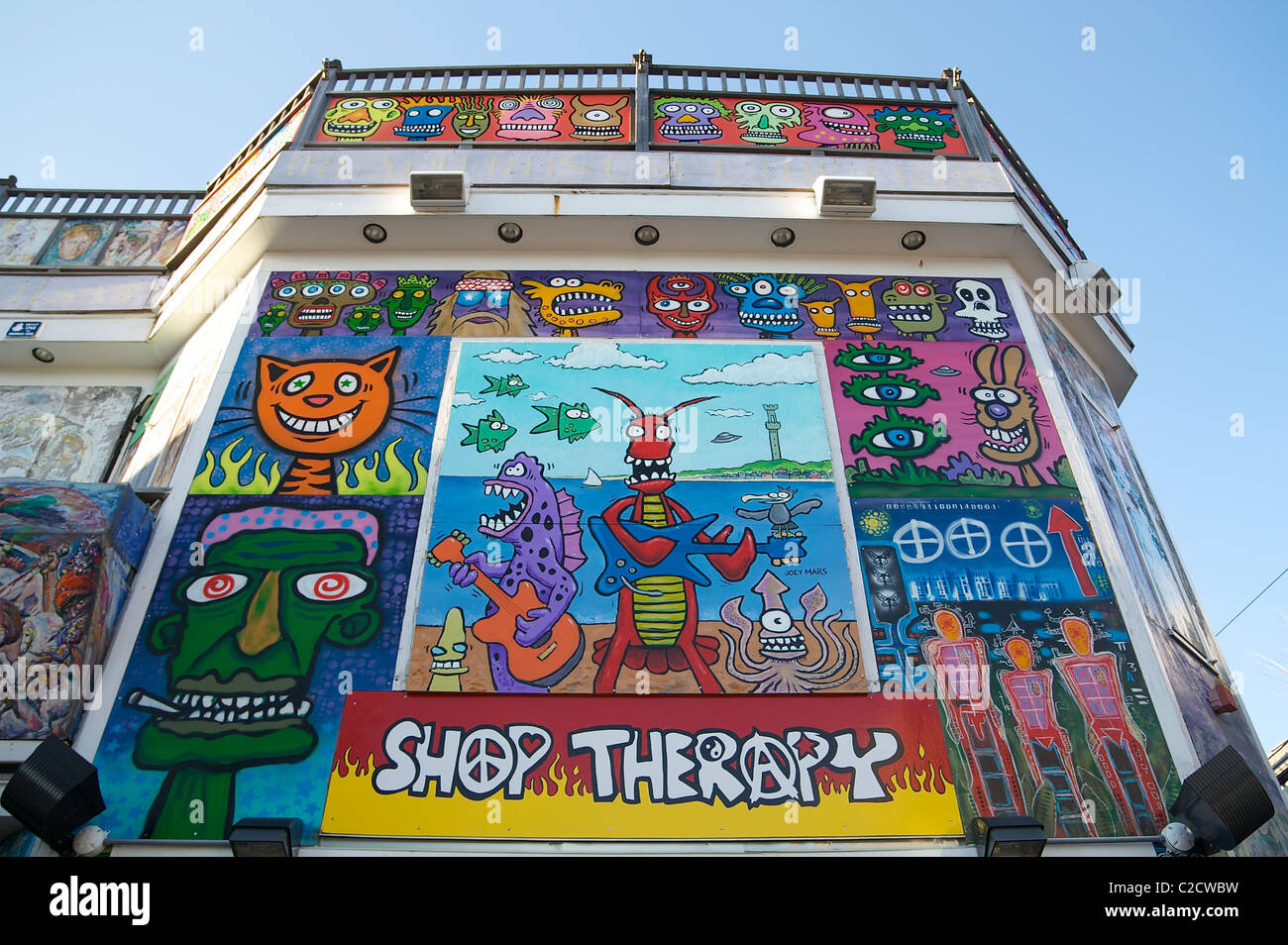 Colorful paintings of animals and imaginary creatures decorate the