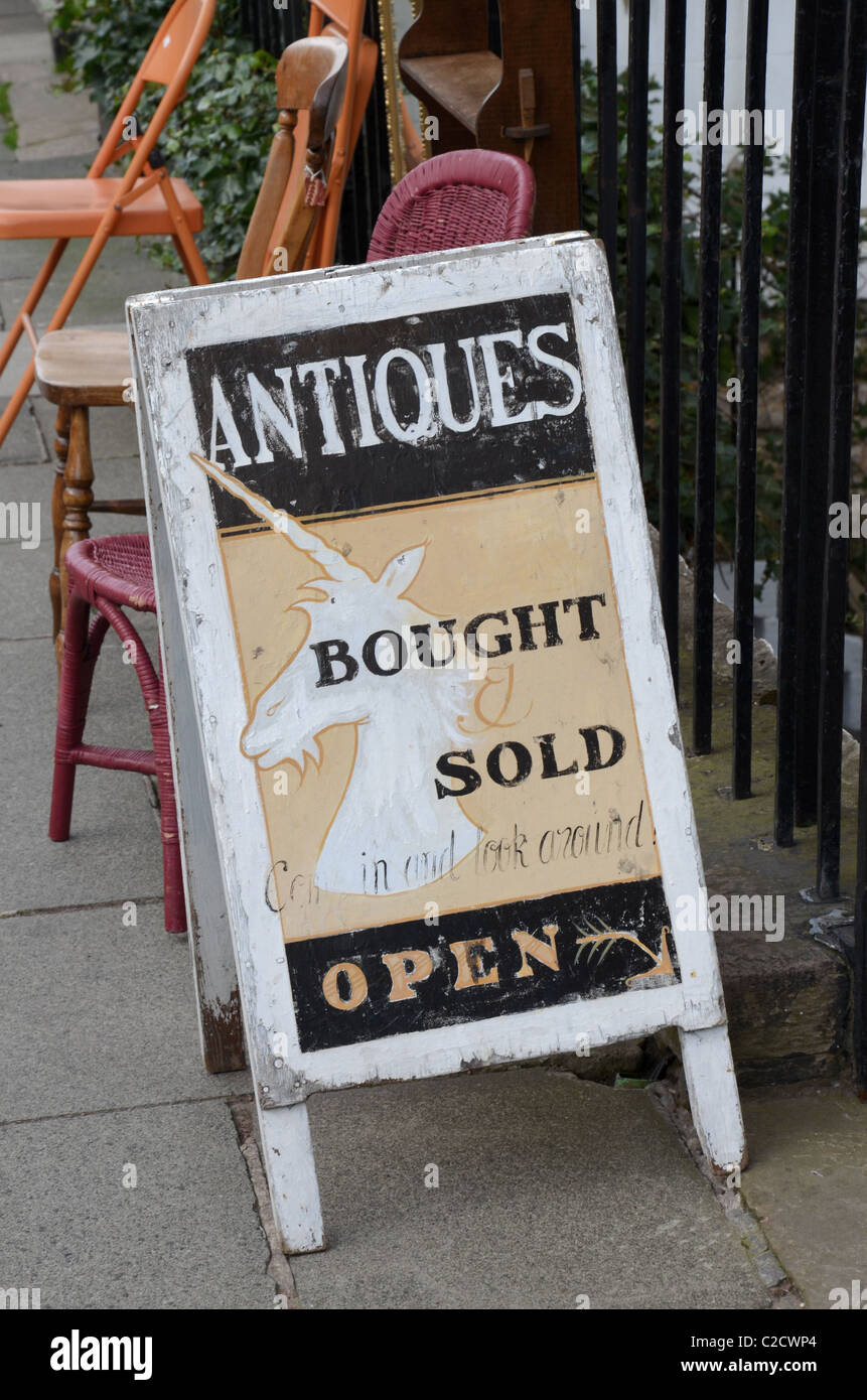 Sign outside an antique shop in Edinburgh's New Town. Stock Photo