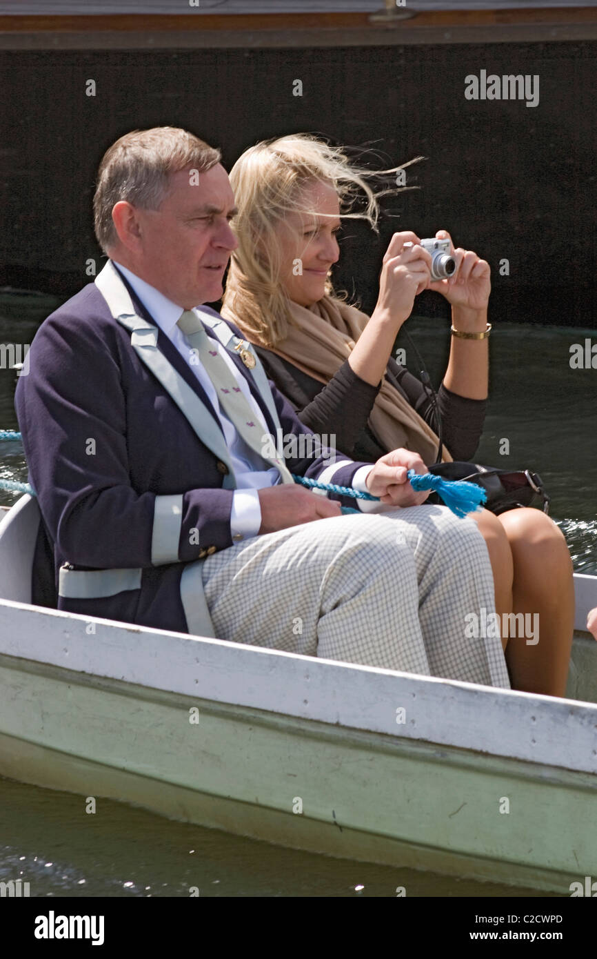 A lady and man in a boat at Henley Royal Regatta on the River Thames in Oxfordshire England UK Stock Photo