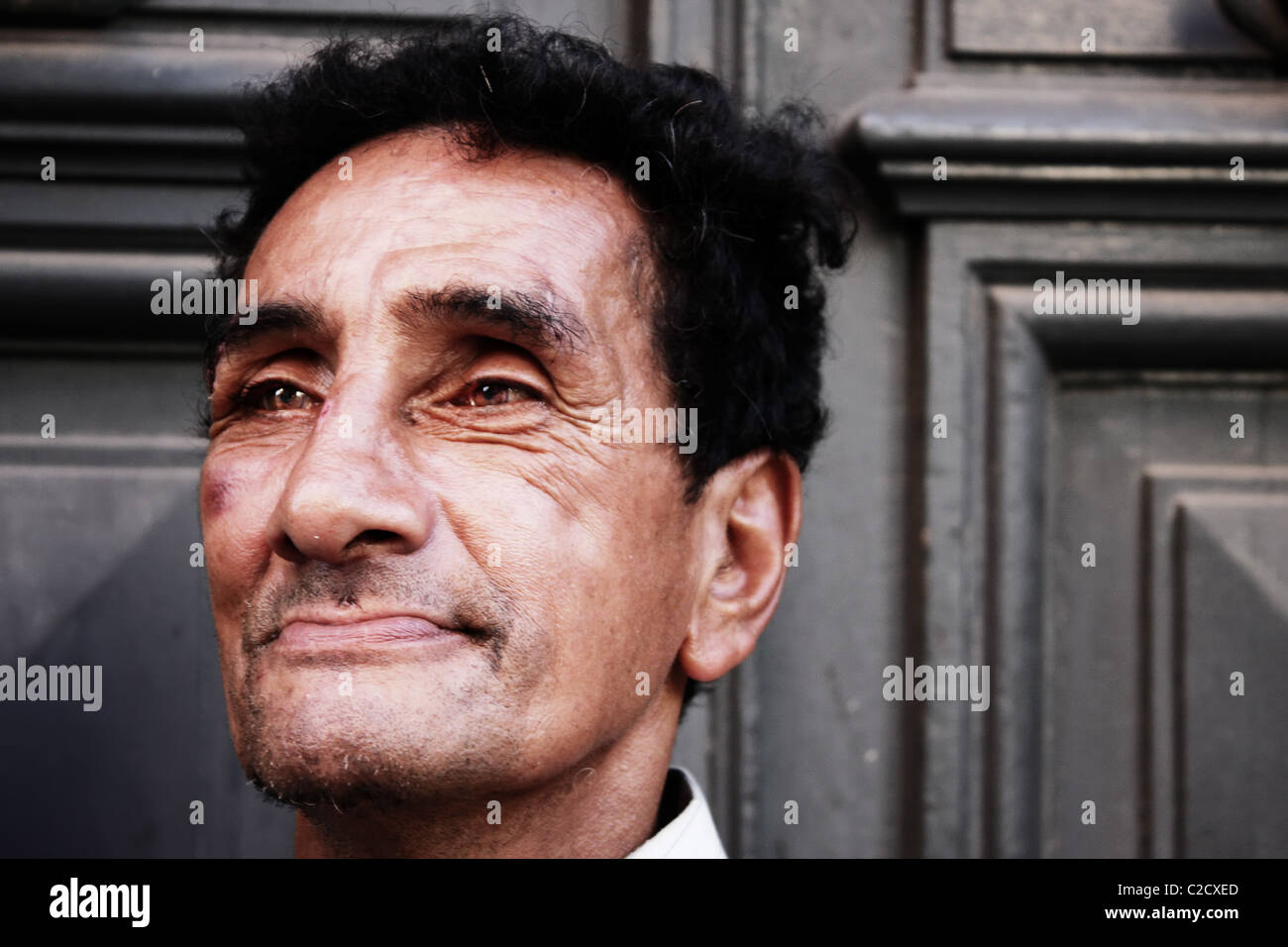 Portrait of a homeless man. Taken in the Ciudad vieja of Montevideo. He was completly drunk and wasted. Editorial use only! Stock Photo