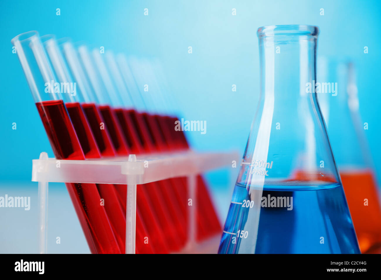 Abstract laboratory glassware equipment over blue background Stock Photo