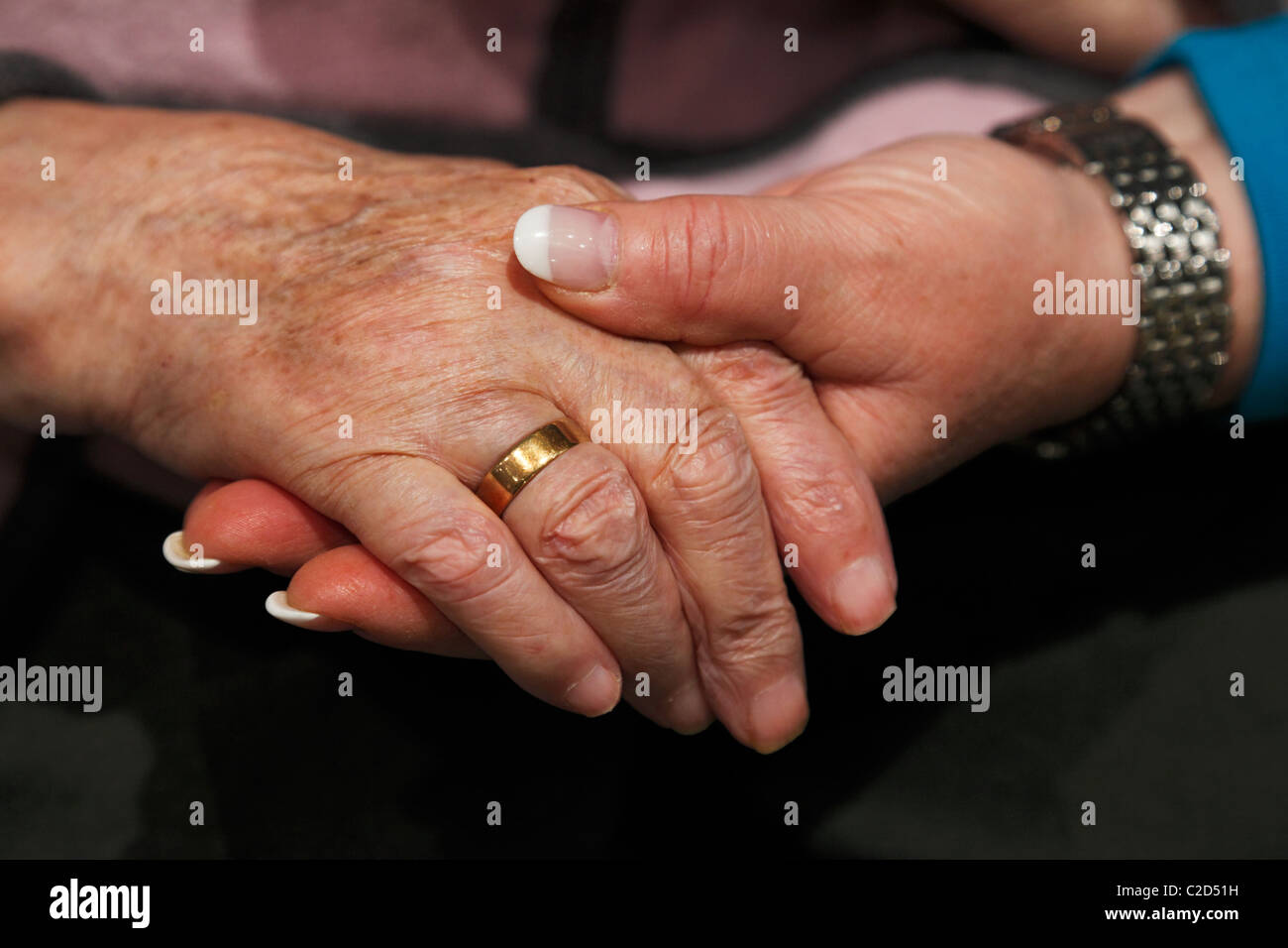 people, old age, retirement home, Altenzentrum der St. Clemens Hospitale in Sterkrade, a nurse holds the hand of an older woman, close-up, Waltraut, Elke, D-Oberhausen, Ruhr area, Lower Rhine, North Rhine-Westphalia, NRW, D-Oberhausen-Sterkrade Stock Photo