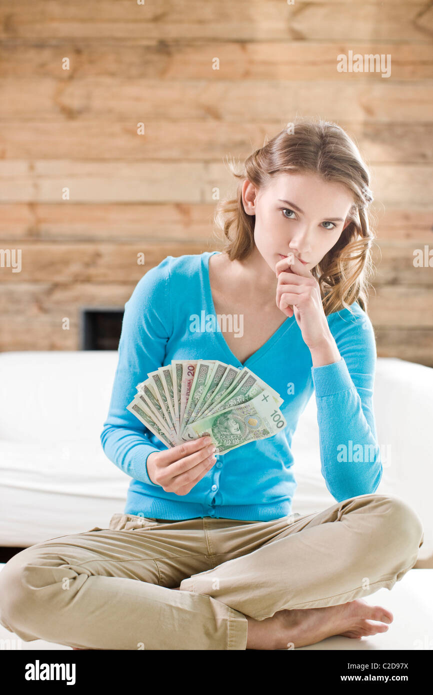 Woman holding cash Stock Photo Alamy