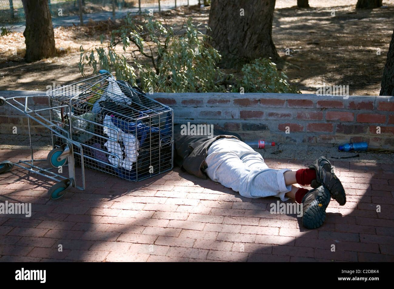 Homeless person sleeping rough on Cape Town sidewalk Stock Photo - Alamy