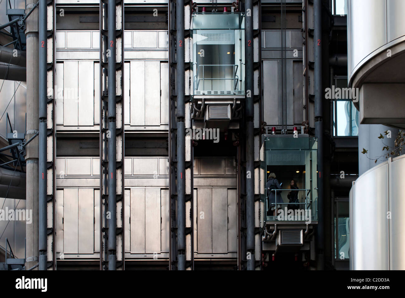 Stainless steel and glass lifts of the Lloyds insurance building in the City of London Stock Photo