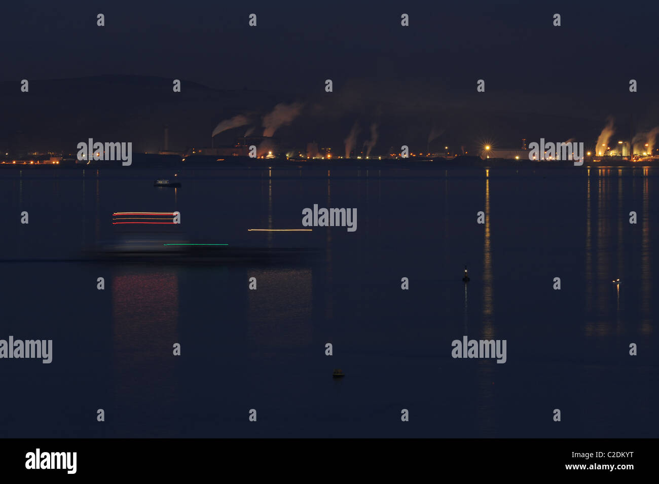 ship leaves on the high tide at night from the safety of a calm bay