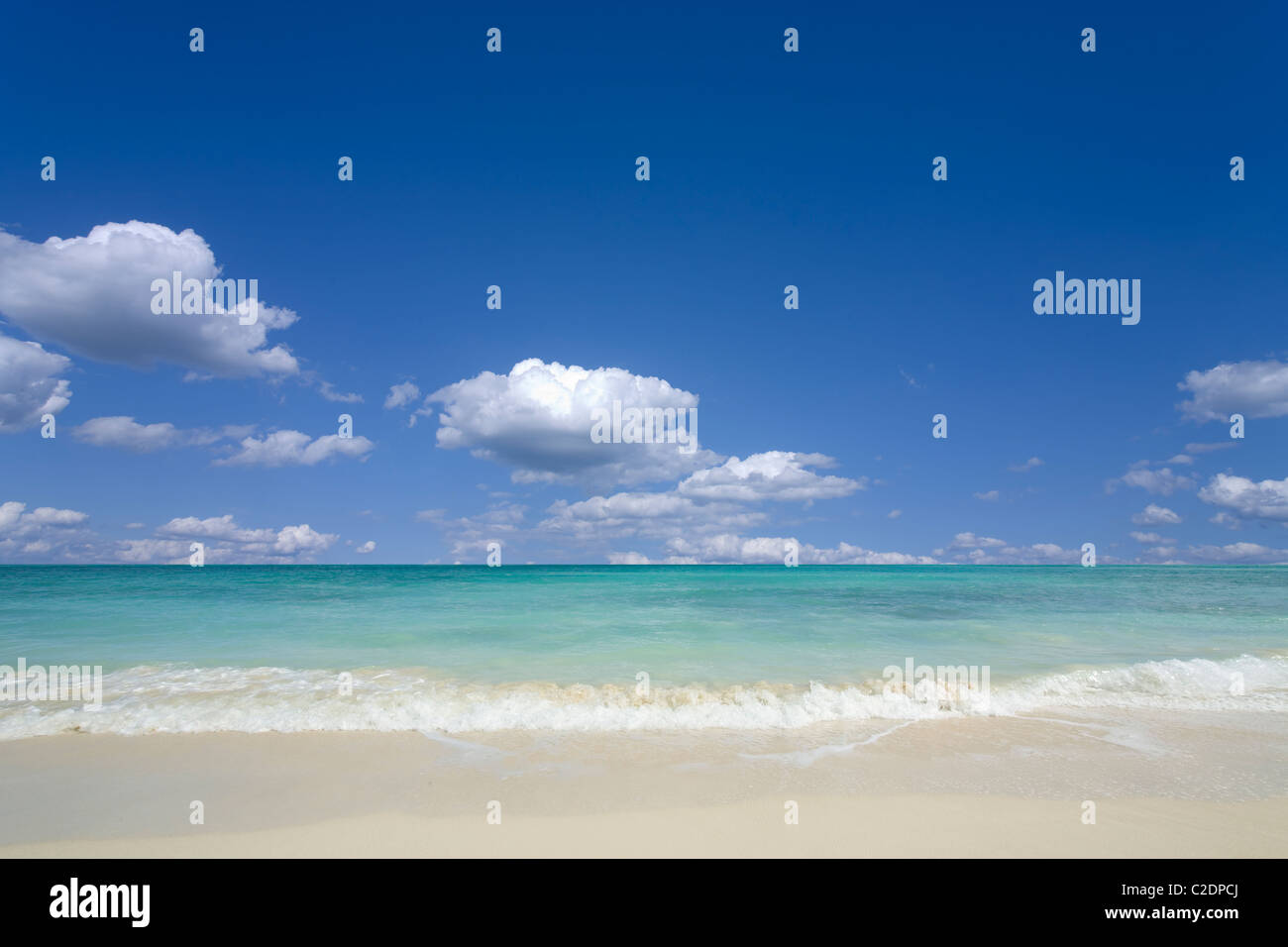 Tropical sand, beach and blue sky Stock Photo - Alamy