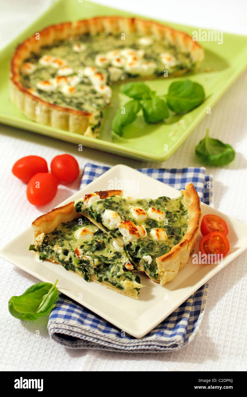 Spinach quiche with goat cheese. Recipe available. Stock Photo