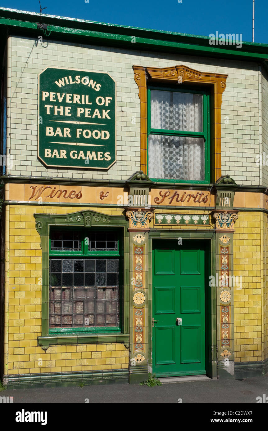 Peveril of the Peak the brightly tiled clad Victorian pub is a popular watering hole in Manchester city centre. Stock Photo