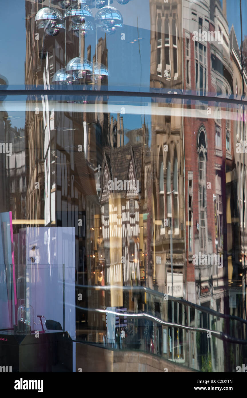 Reflection of The Shambles and The Triangle Shopping Centre in Exchange Square, Manchester Stock Photo