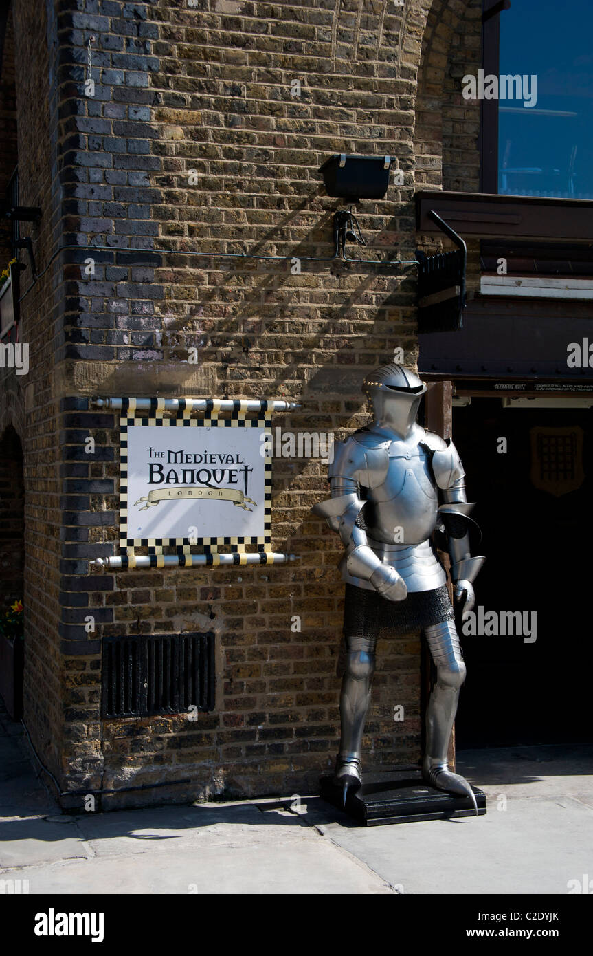Suit of armour advertising the Medieval Banquet restaurant at St Katherine's Dock, London, England UK Stock Photo