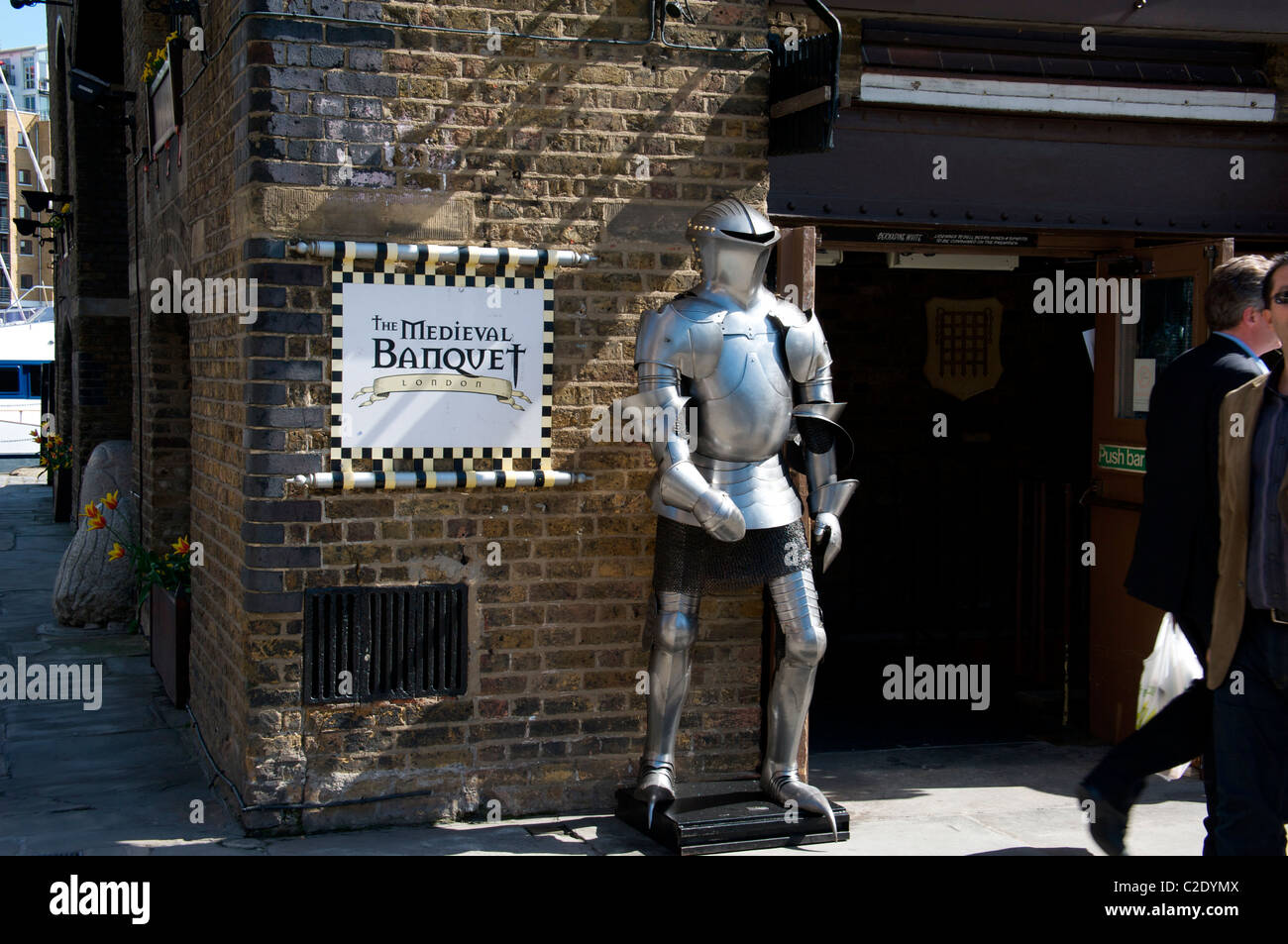 Suit of armour outside the Medieval Banquet restaurant, St Katherine's Dock, London, England UK Stock Photo