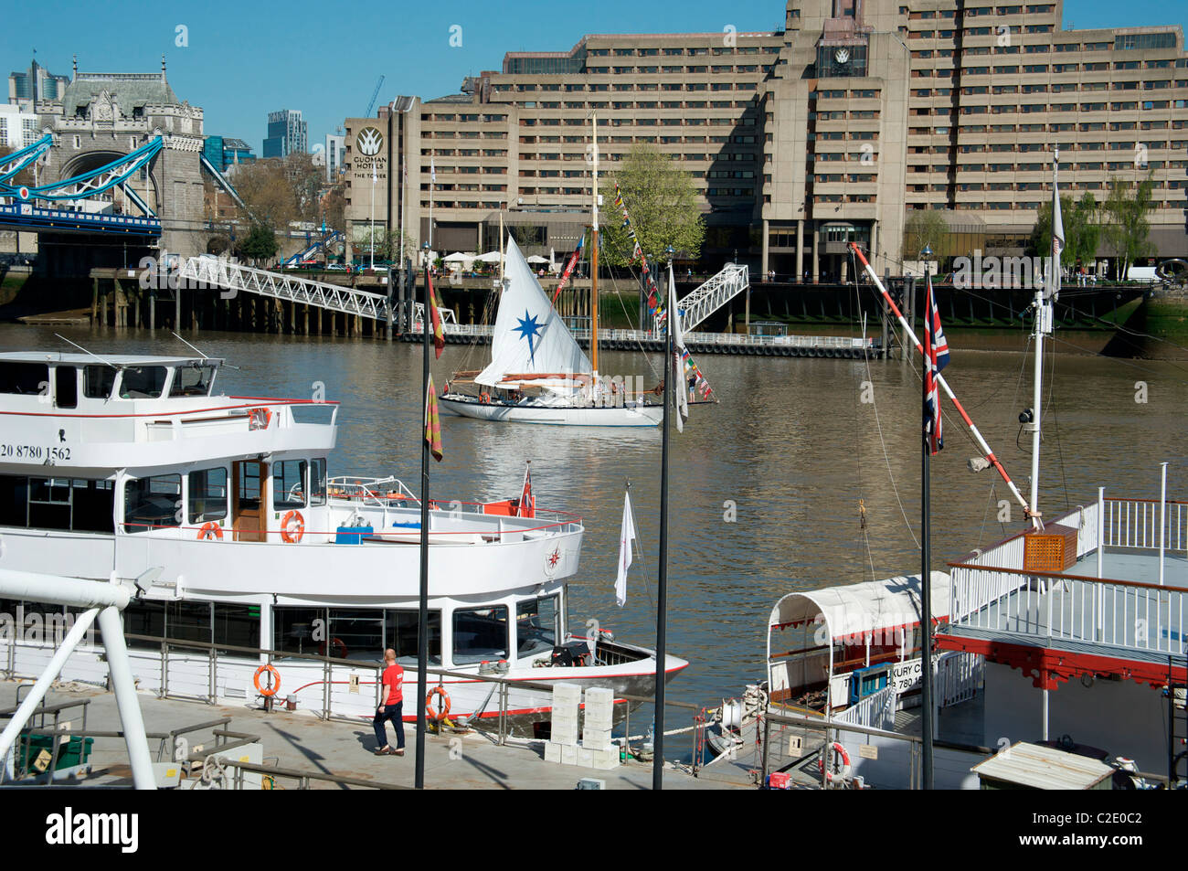 Sailing boat the Morning Star sails past the Tower Hotel, London