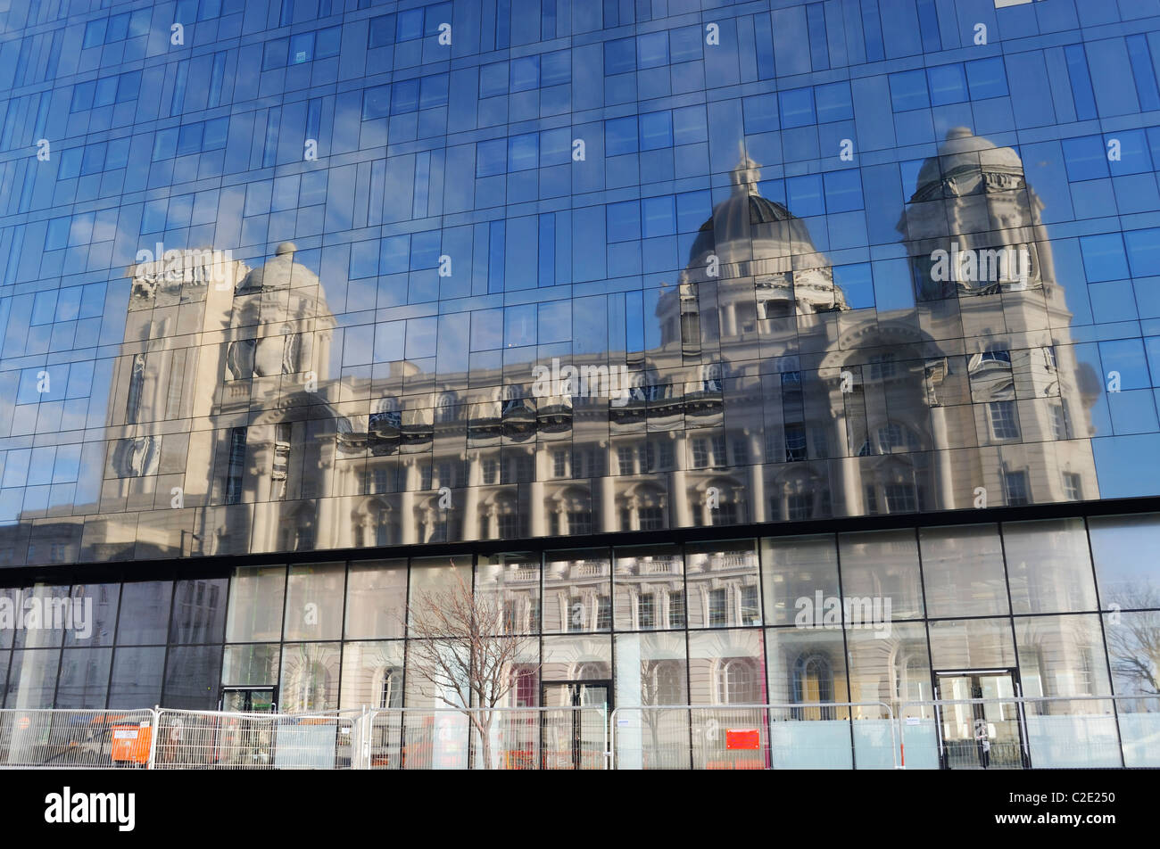 Reflection of the Port of Liverpool Building is a Grade II listed building situated at Pier Head on Liverpool's waterfront. Stock Photo