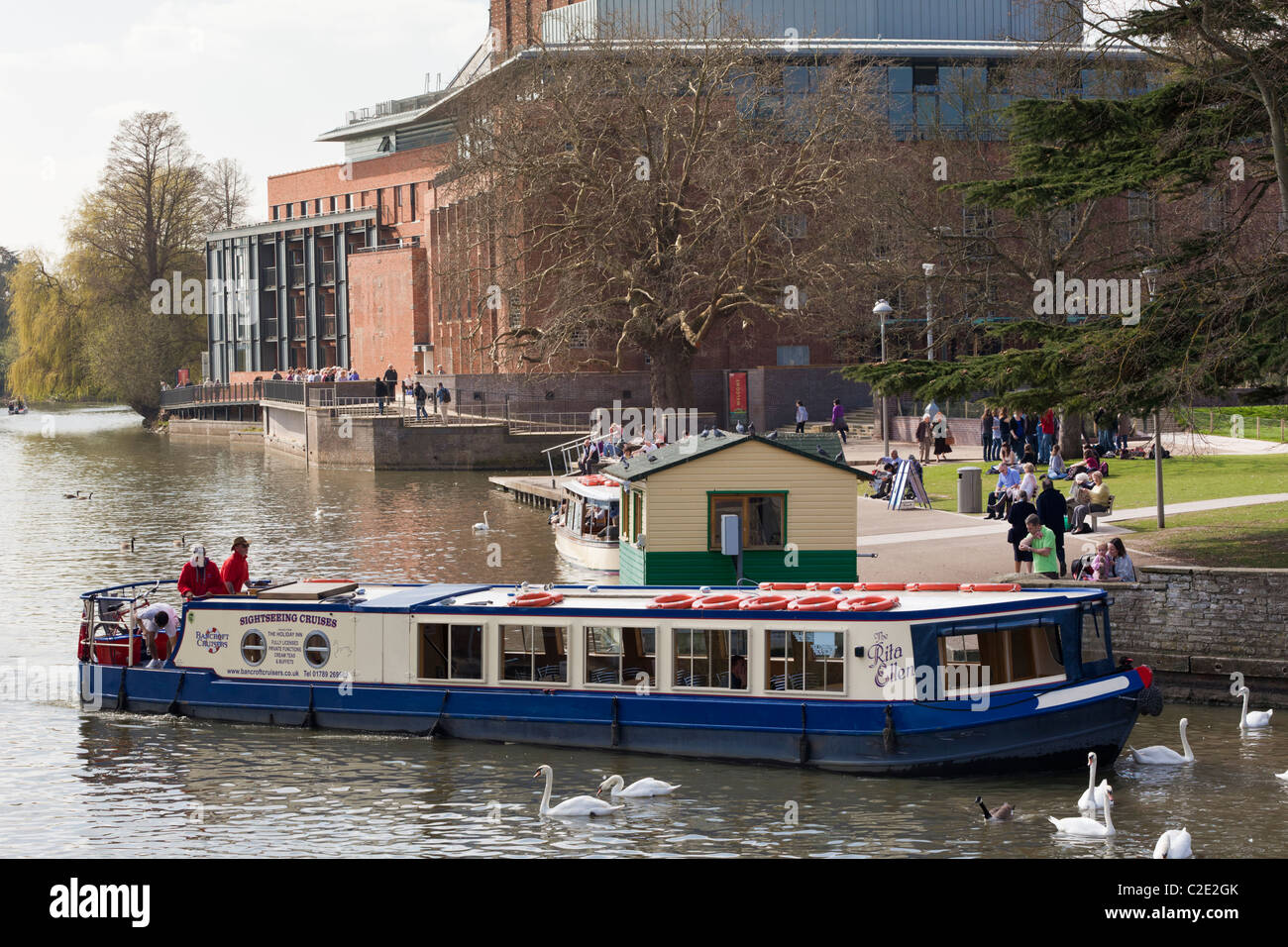 A sightseeing cruise boat on the River Avon passing the Royal ...