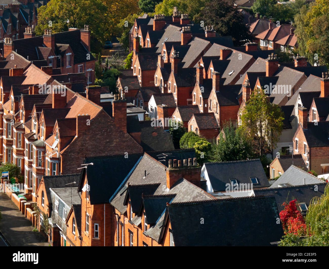 View looking down on terraced red brick houses in Nottingham city centre England UK Stock Photo
