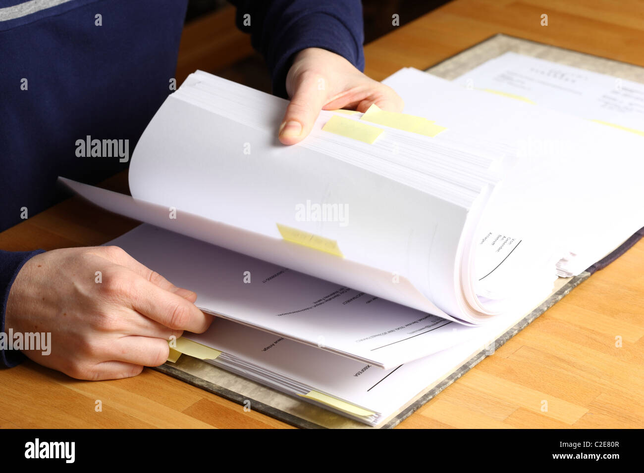 Office, files, person looks through a document file. Stock Photo
