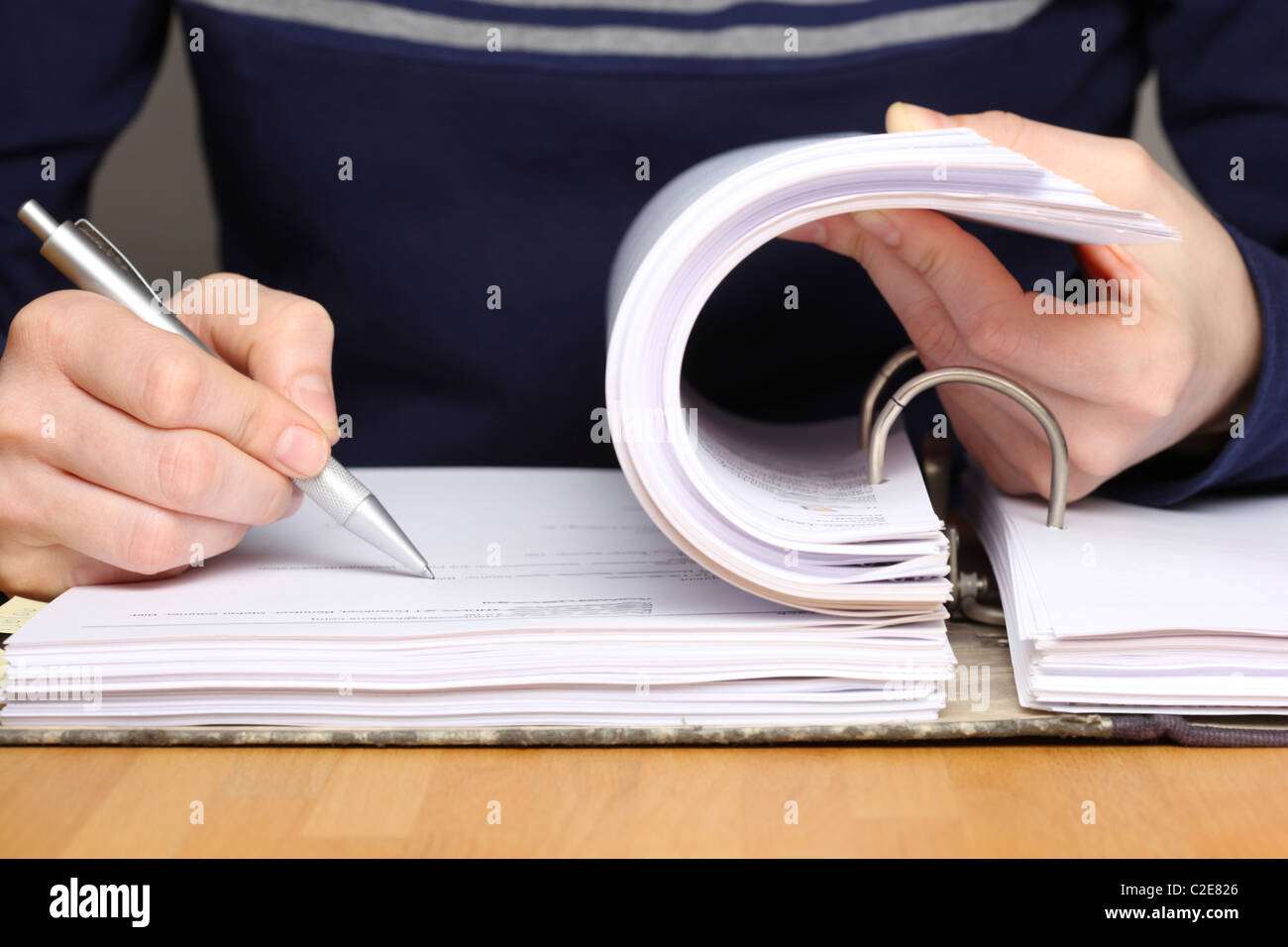 Office, files, person looks through a document file. Stock Photo