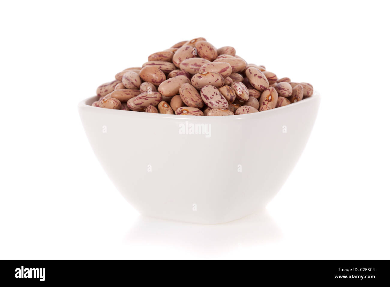 Pinto beans in a bowl isolated on a white background Stock Photo