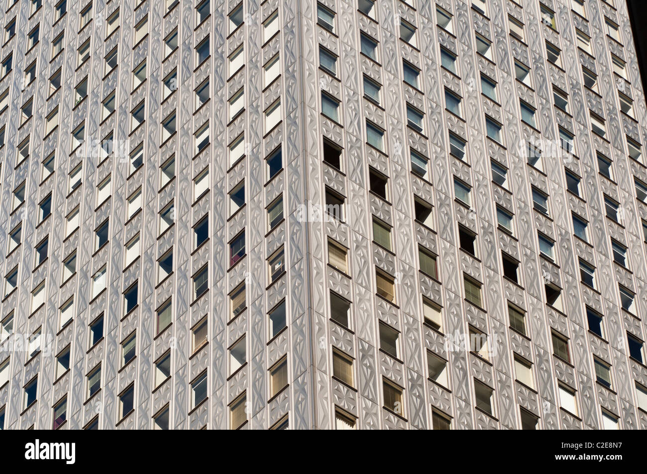 Steel, stainless, self cleaning geometrical pattern facade of Mobil Building, Manhattan, New York City, USA Stock Photo