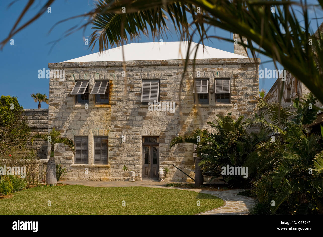 Palm tree frames a building at the Royal Naval Dockyards, Sandys Parish