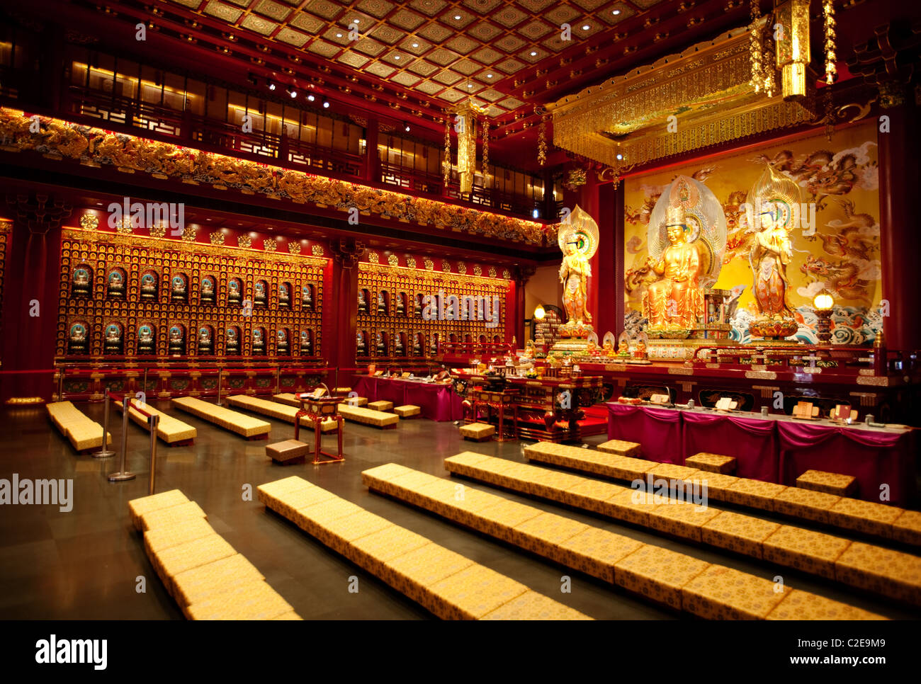 An interior of a Buddhist temple with a Buddha statue Stock Photo