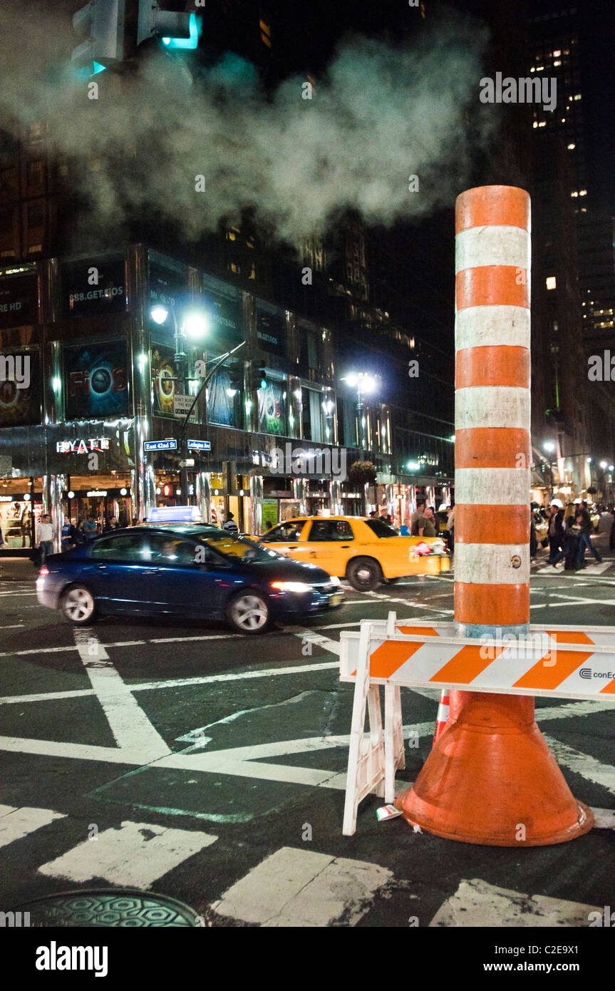 Red and white street steam chimney is part of Manhattan steam heating