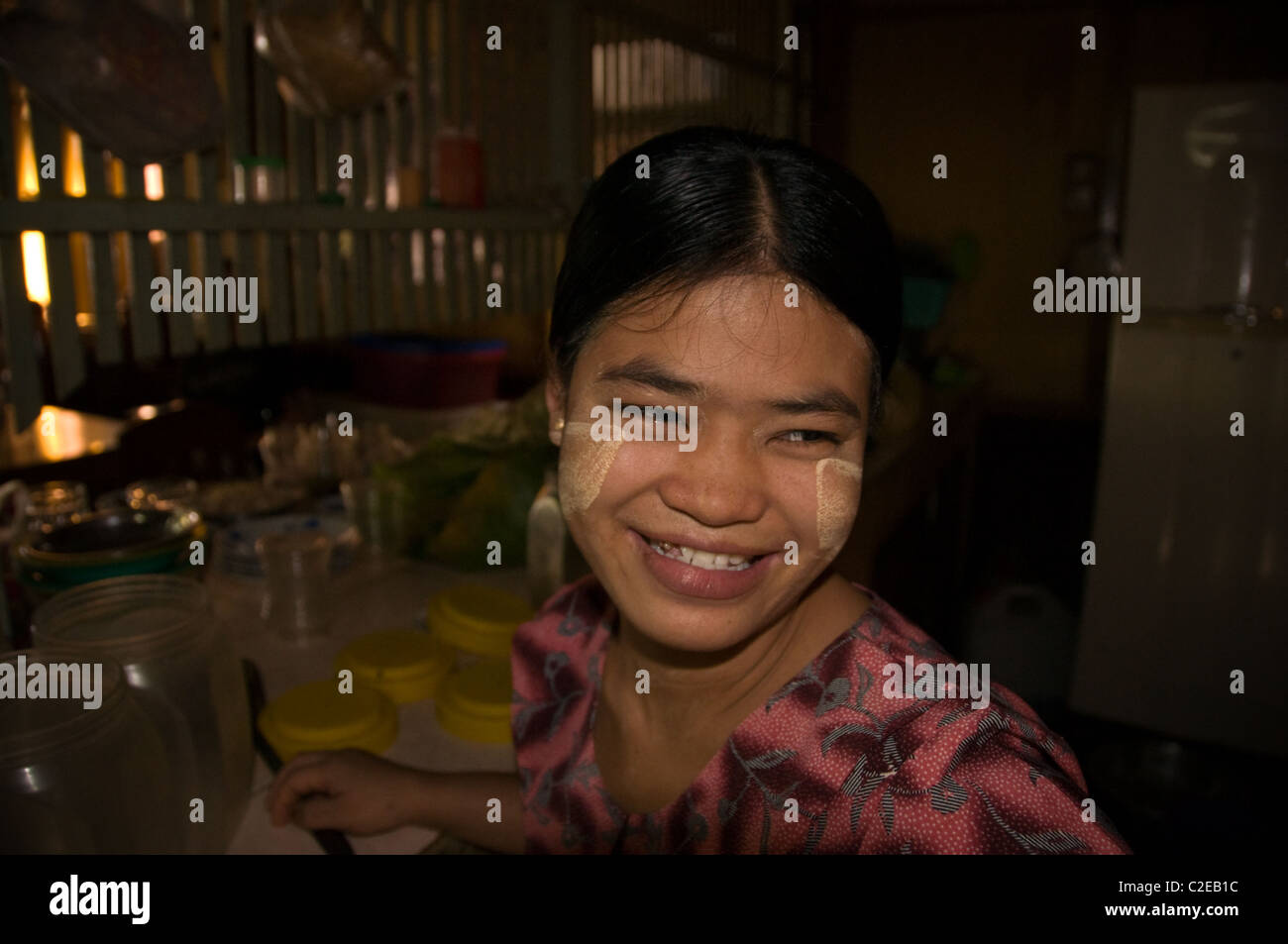 Pyay, Burma - Portrait of a Burmese girl with traditional tanaka make up working in one of the town restaurant. Stock Photo