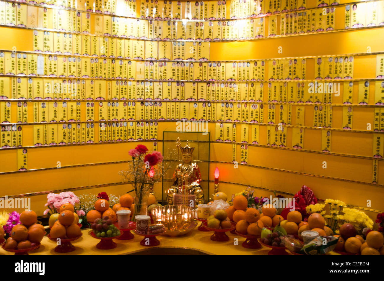 Small prayer cards at dead ancestors memorial wall, Mahayana Buddhist Temple, Chinatown, Manhattan, New York City, USA, Buddhism Stock Photo