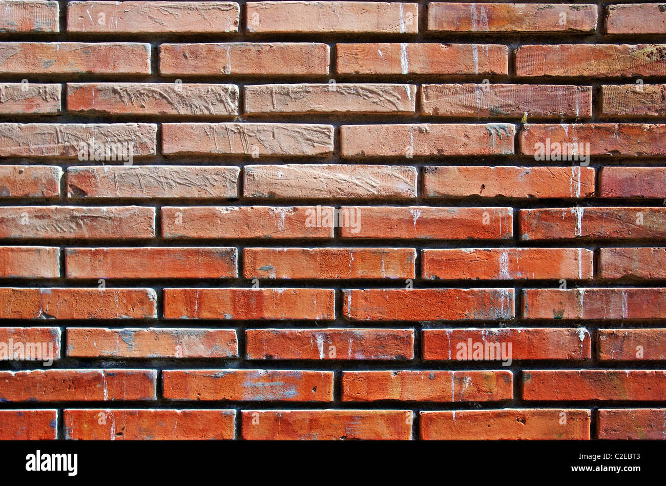 Abstract orange wall made of bricks. Good as background or backdrop. Stock Photo