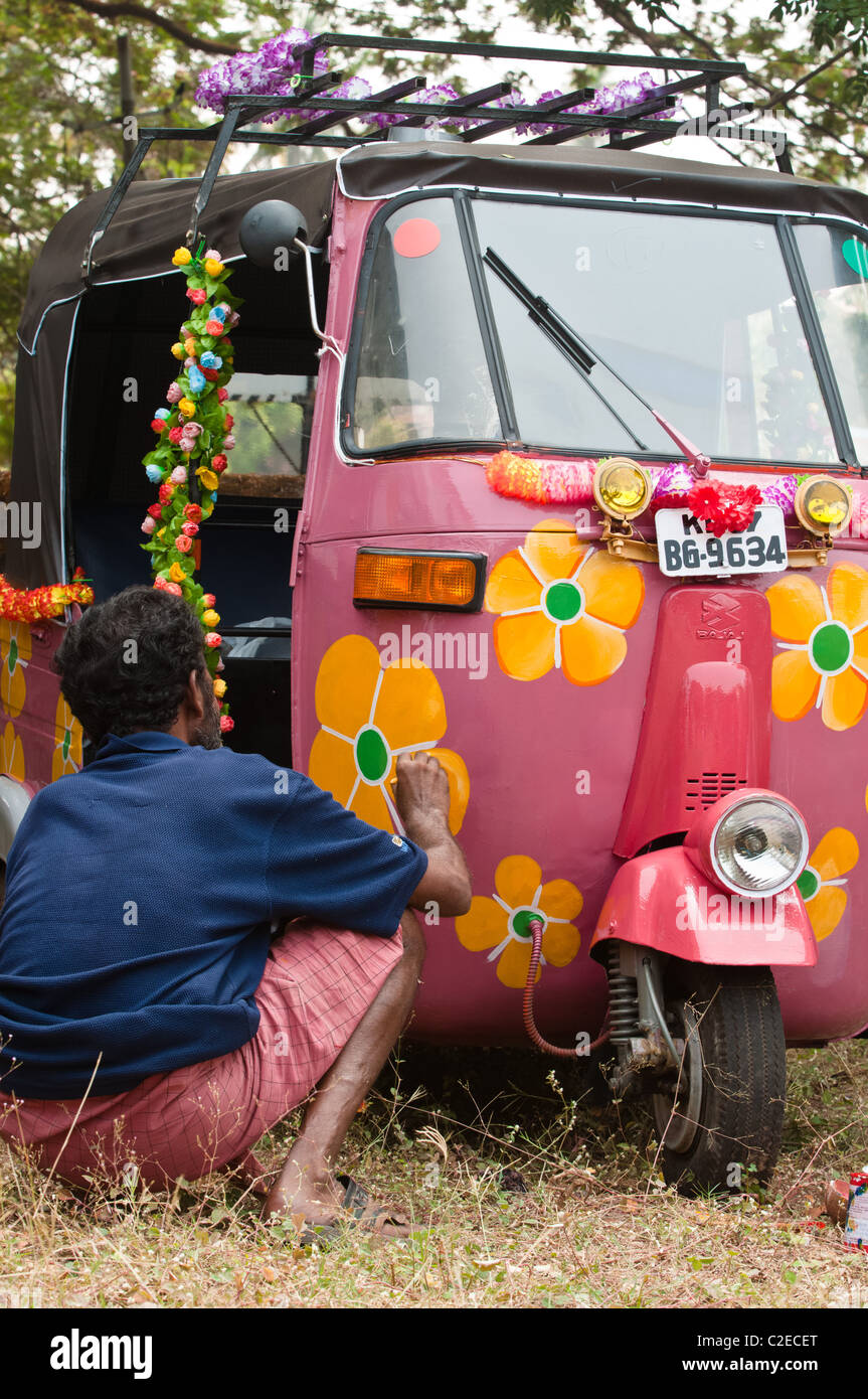 Local artist pimps up tuk tuk for the Rickshaw Run in India Stock Photo